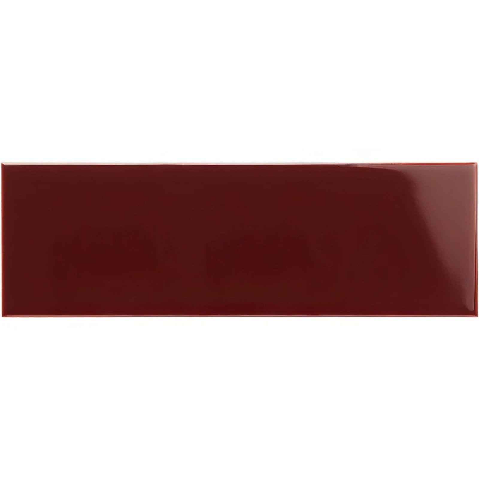 A glossy burgundy large brick tile with a smooth reflective surface ideal for wall and floor applications