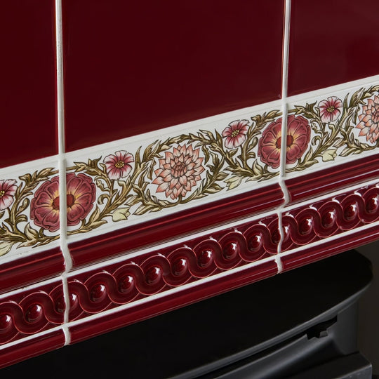 Burgundy omega moulding red ceramic tiles with decorative pink and maroon floral border and green leaves ornate pattern