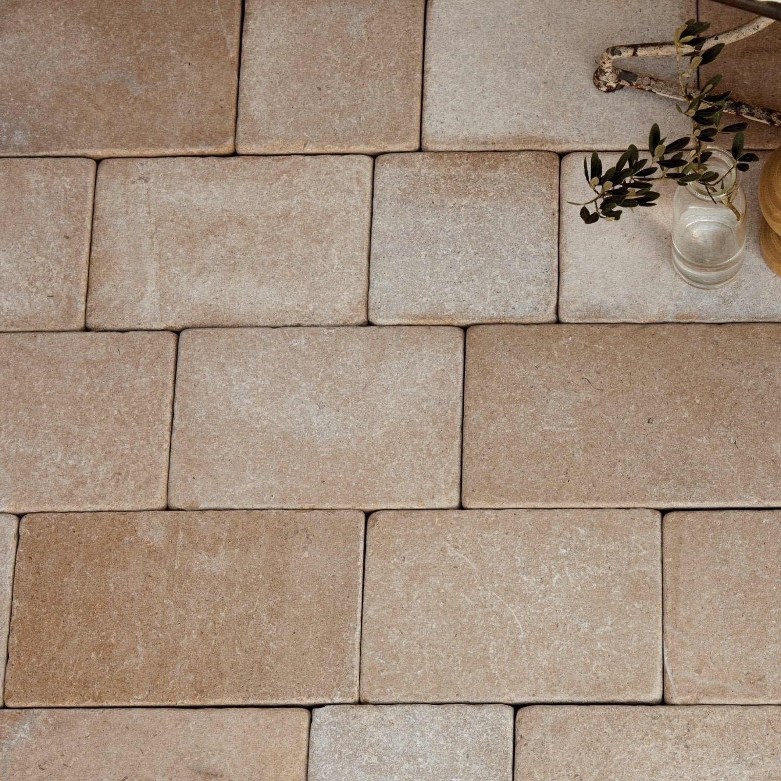 Beige rectangular buscot limestone cobble pavers with tumbled and etched textured natural finish