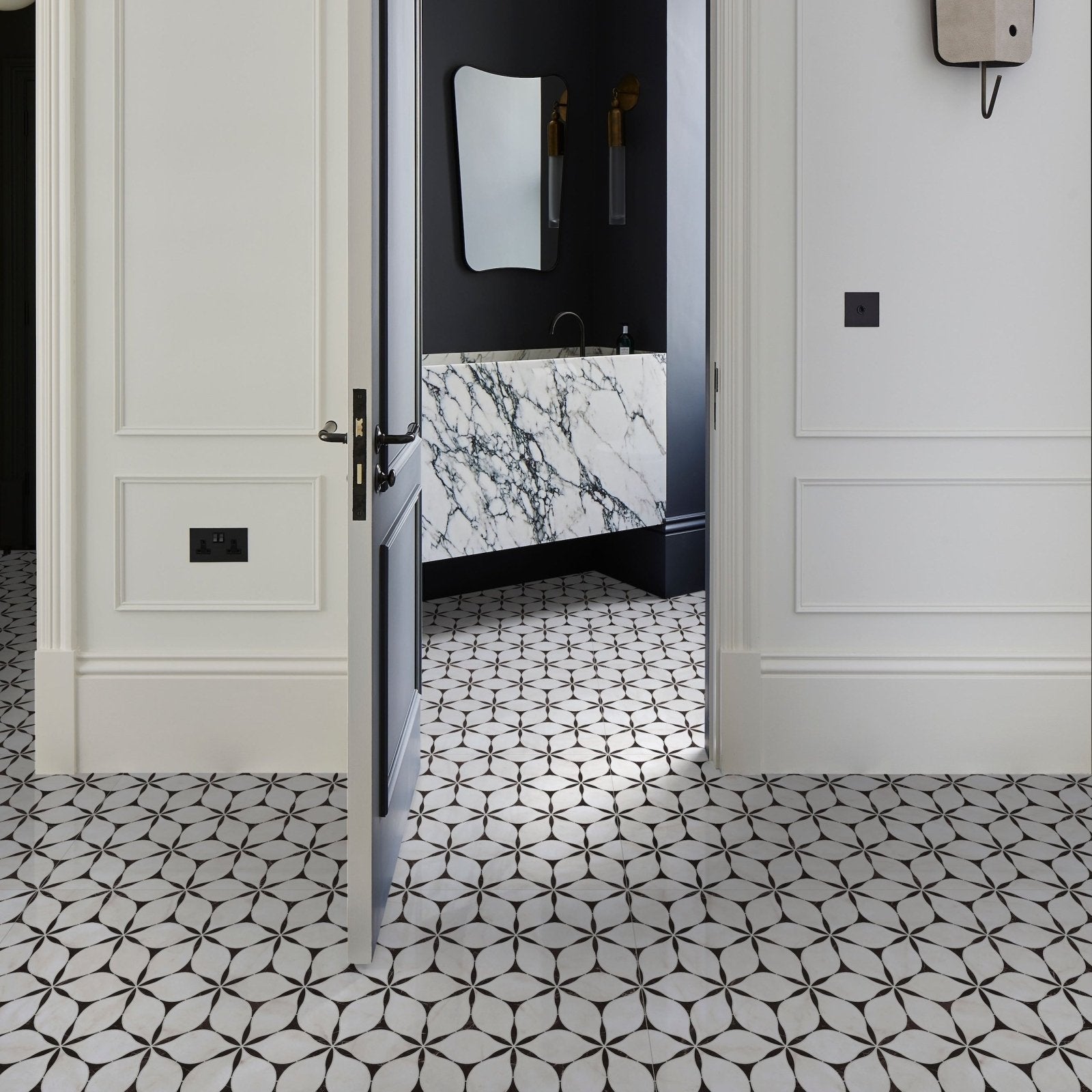 Black and white geometric patterned porcelain floor tiles from the byzantine porcelain elysium sculpted collection
