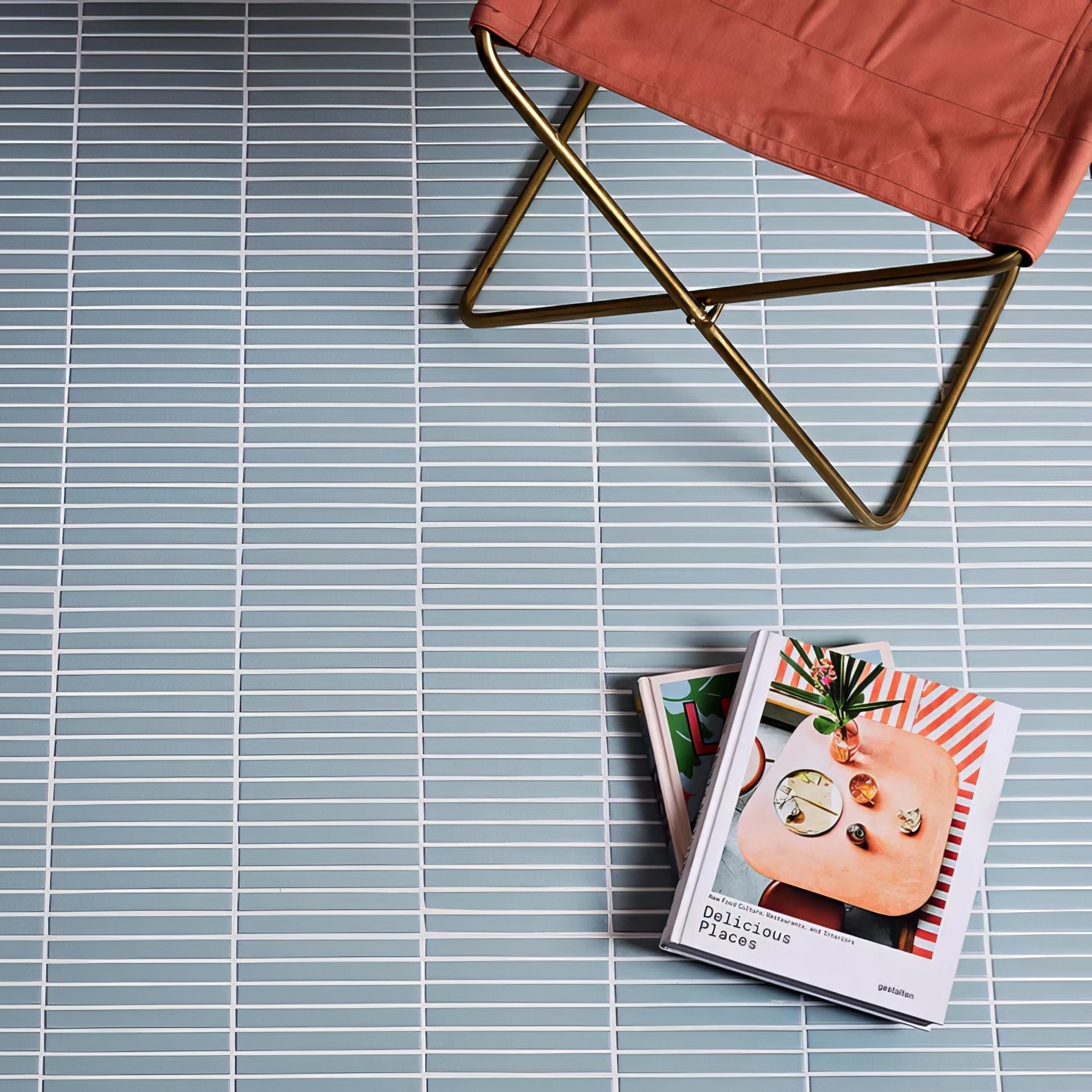 Candy Cane Porcelain Mosaic Wintergreen light blue ribbed porcelain mosaic flooring with a coral fabric chair