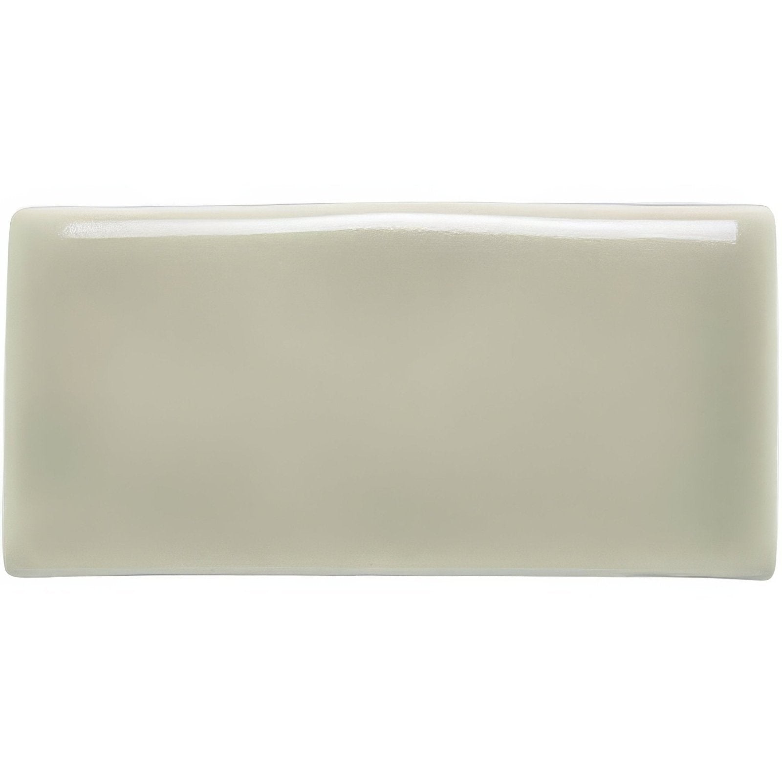 A sleek rectangular ceramic canvas half tile with a smooth glossy off-white finish