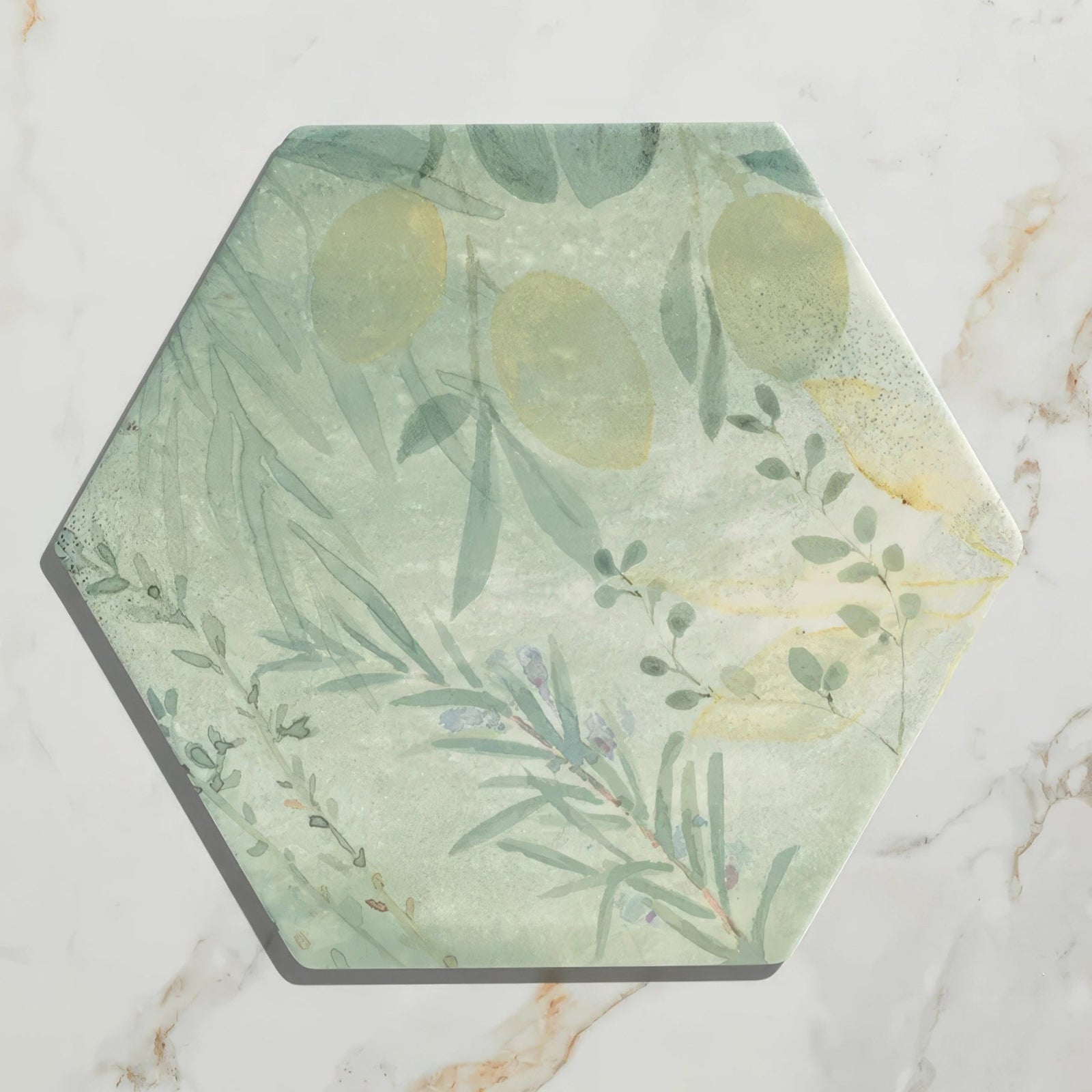 Capri porcelain hexagonal coaster with soft green and yellow botanical lemon design on textured stone surface