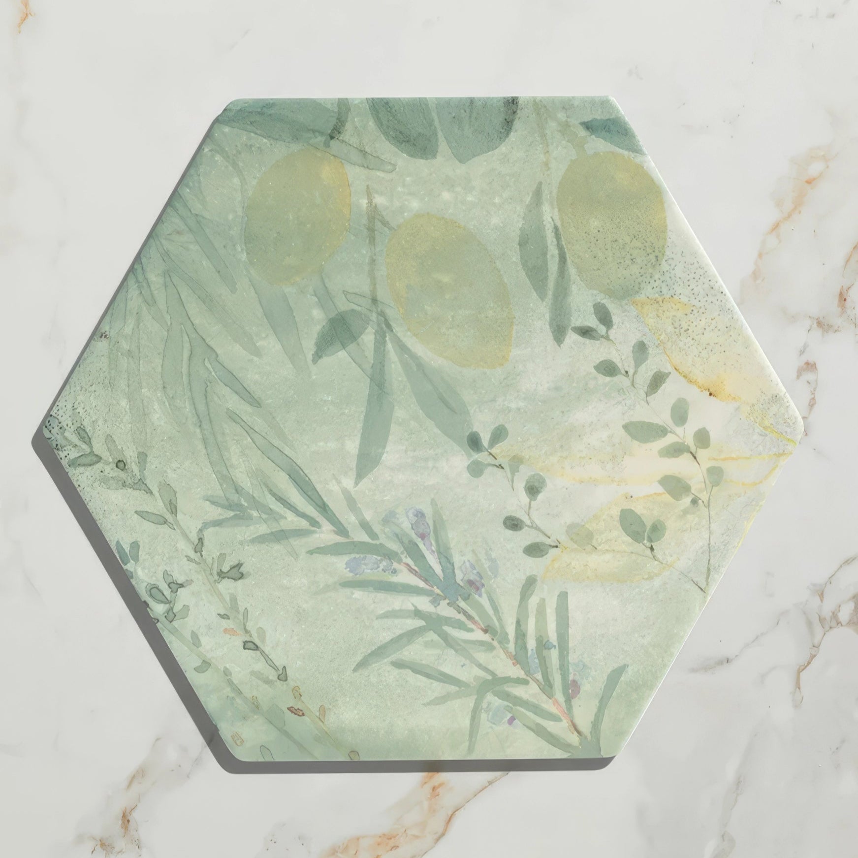 Capri porcelain hexagonal coaster with soft green and yellow botanical lemon design on textured stone surface