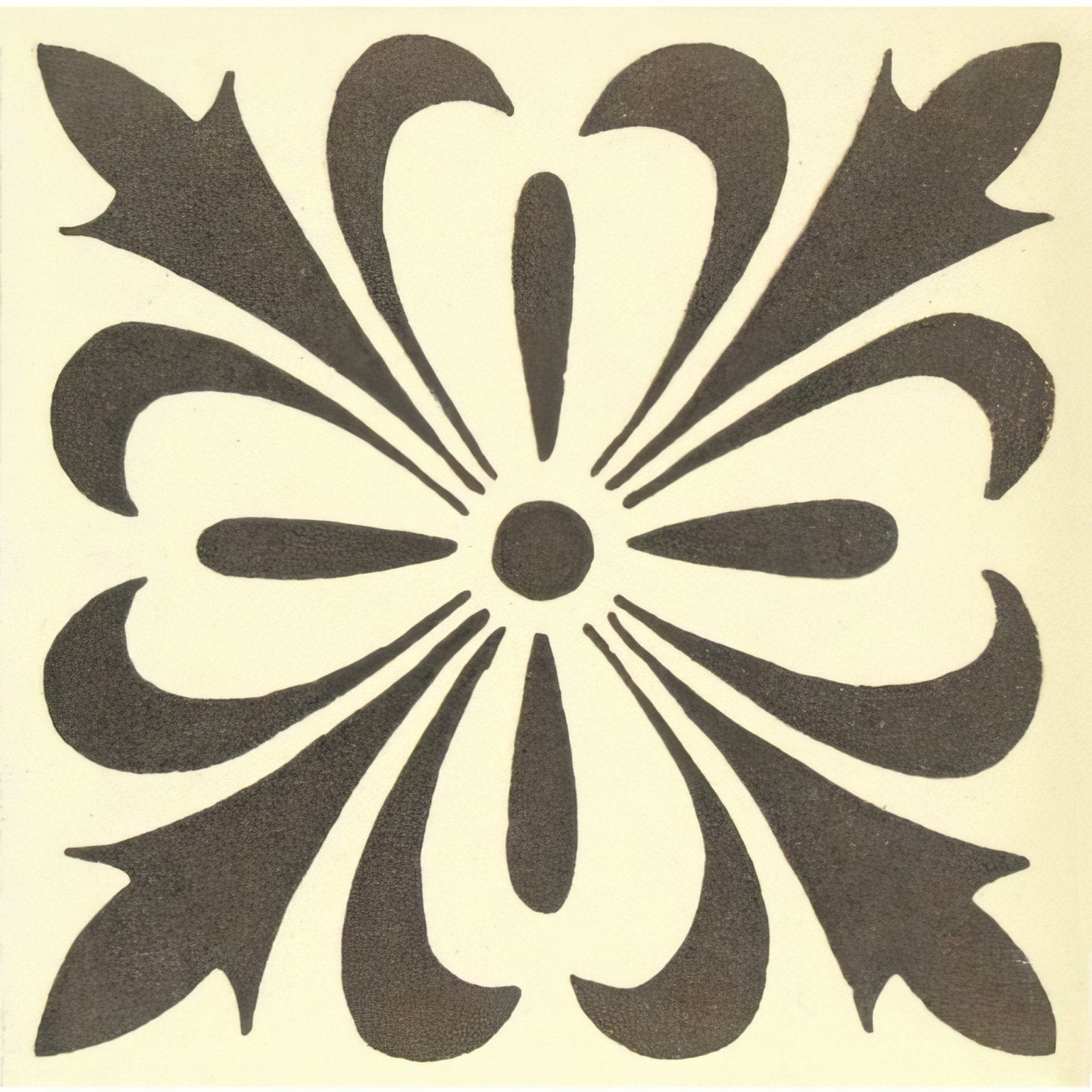 Cardigan dark brown on white featuring a black and cream floral tile with a symmetrical stylized petal design