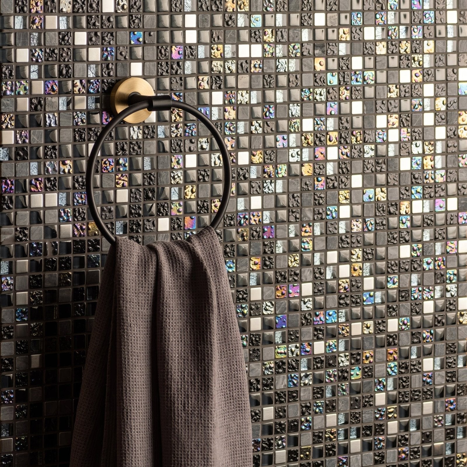 Carinthia Earth and Fire Mixed Mosaics grey, black and iridescent blue mosaic with a black towel ring and grey towel