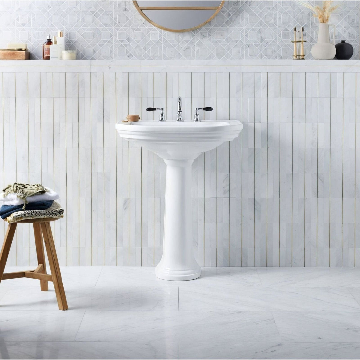 Carrara White Marble 45.7 x 45.7cm white marble tiles with a pedestal sink and black taps