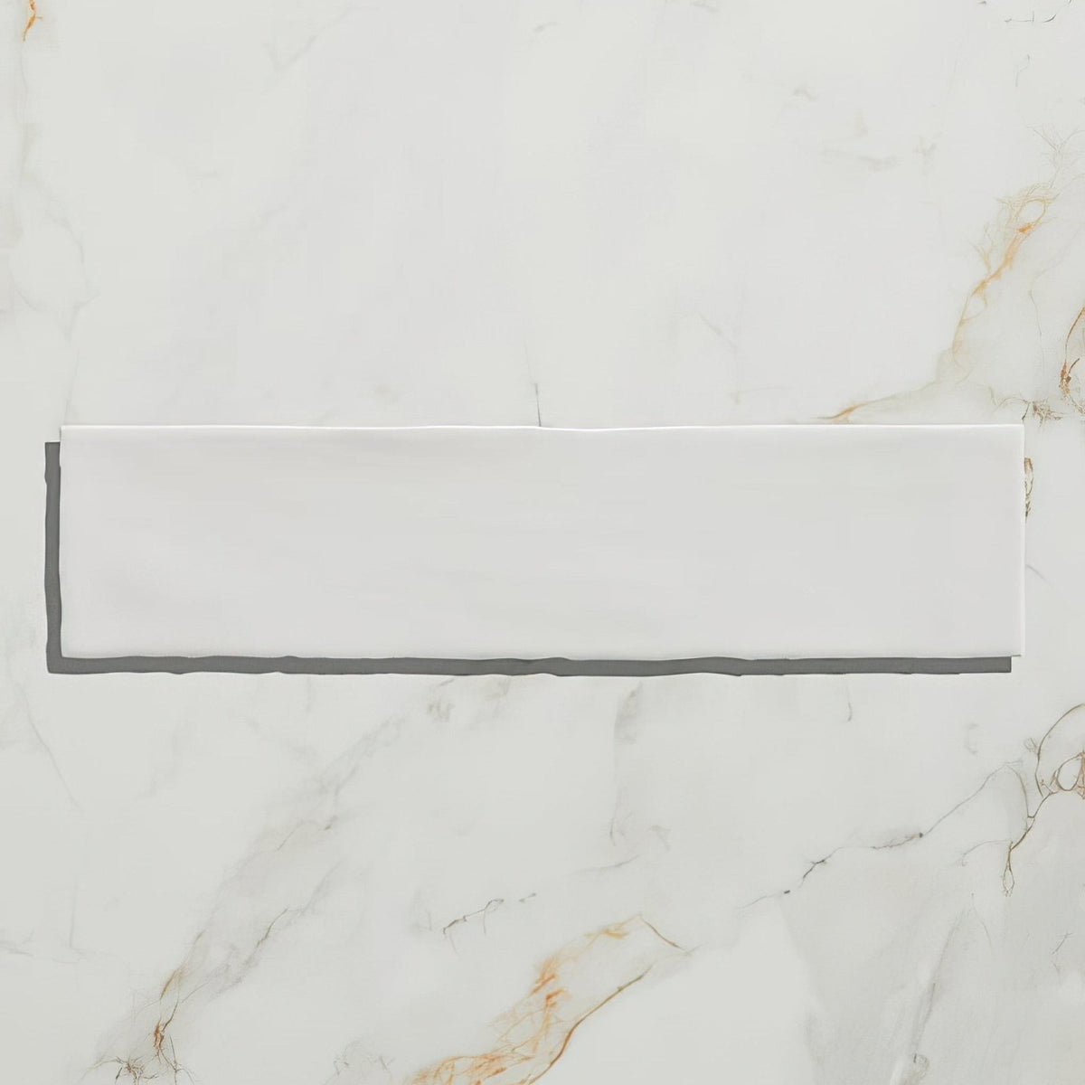 Carter ceramic white is a sleek rectangular white ceramic tile with a smooth glossy finish on a marble surface