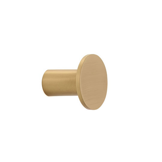 A sleek matte-finished brass carter hook with a cylindrical stem and circular head for wall mounting