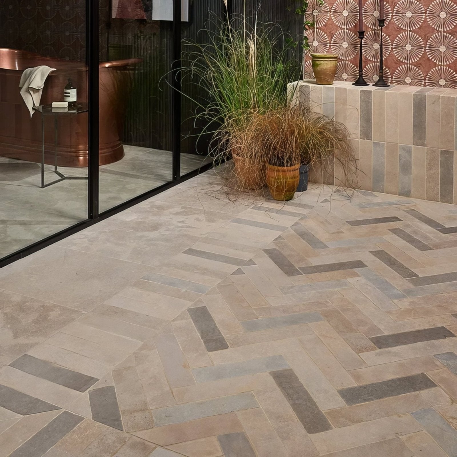 Beige and gray herringbone patterned castilan limestone parquet tumbled stone floor tiles