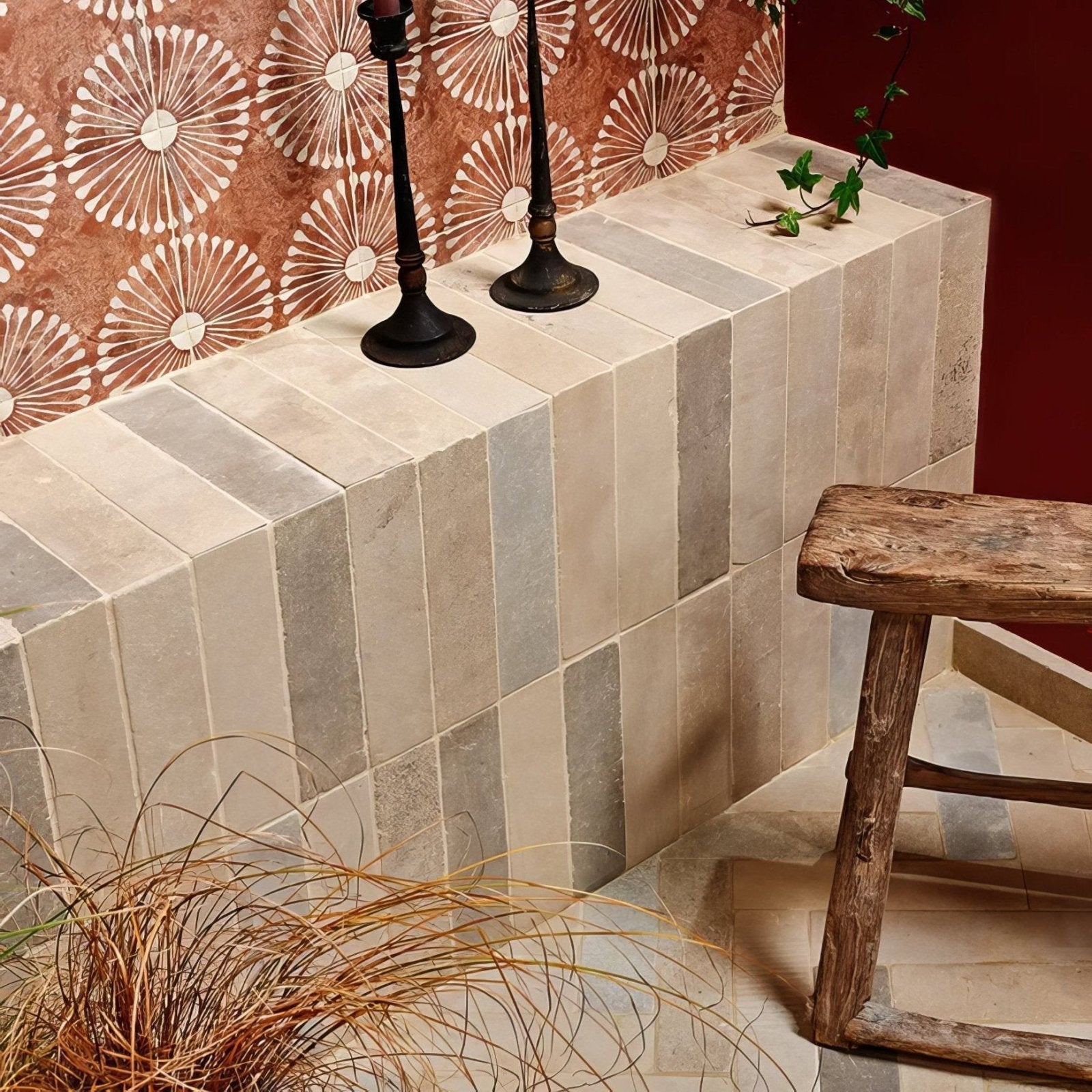 Beige and gray rectangular castilan limestone parquet tumbled tiles arranged in a vertical striped pattern