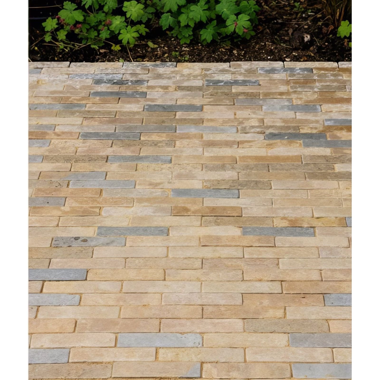 Beige and gray castilan limestone tumbled klinkers stone pavers arranged in a staggered pattern