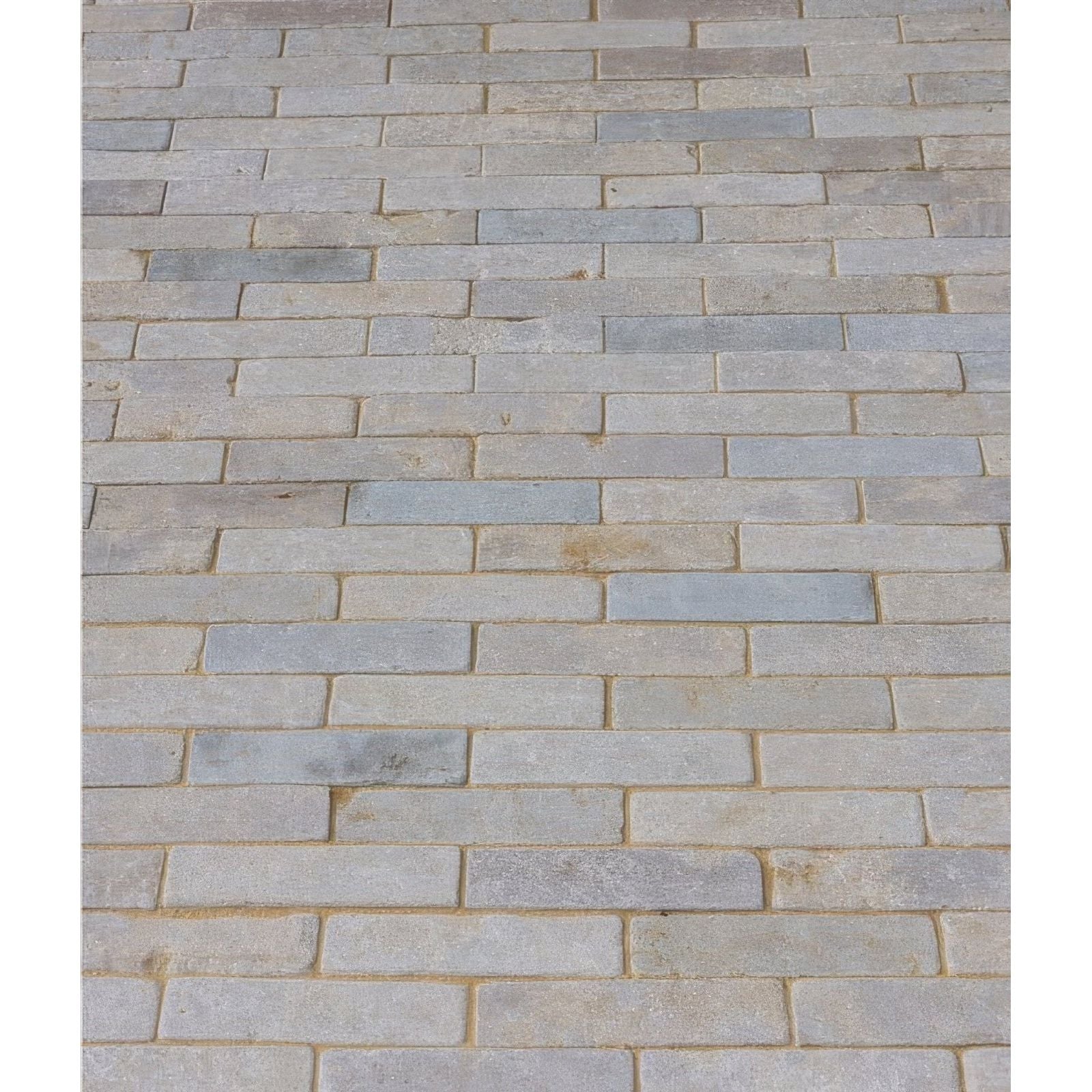 Castilan limestone tumbled klinkers gray rectangular paving stones arranged in a staggered pattern with subtle texture variations