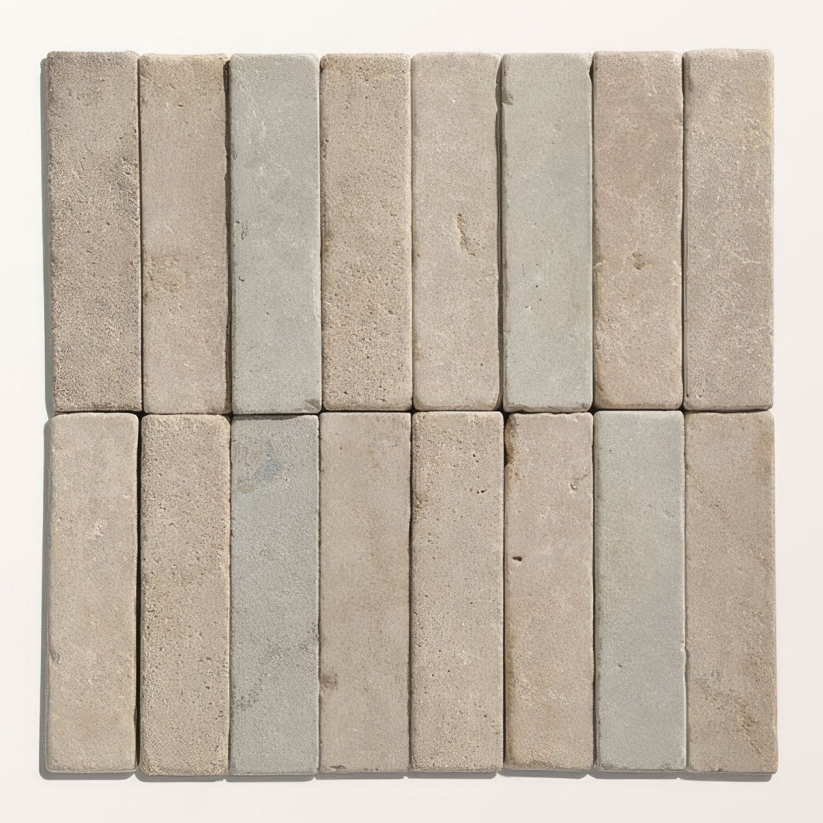 Rectangular castilan limestone tumbled klinkers in muted beige and soft gray tones arranged in two neat rows
