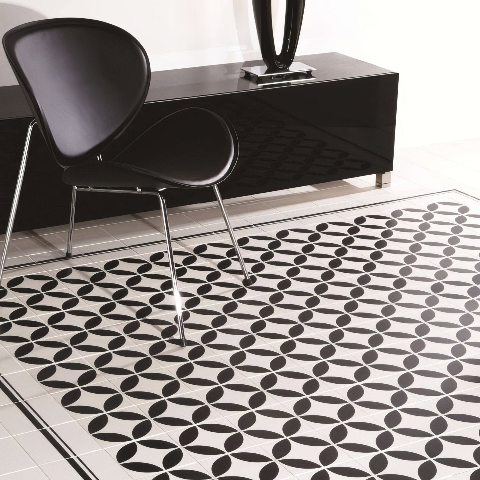 Black and white geometric patterned floor tiles with glossy finish from the Cavendish Border Black on Dover White collection