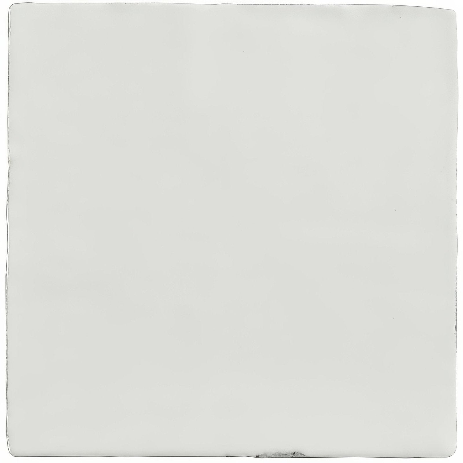Chalk field tile is a smooth off-white ceramic tile with slightly rounded edges and a subtle glossy finish