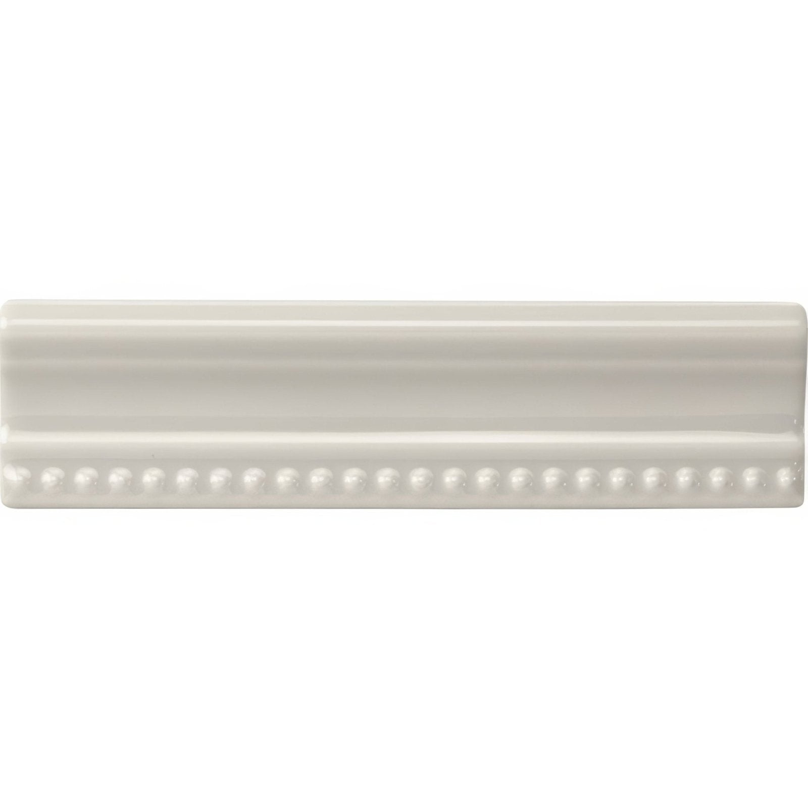 Cream-colored ceramic Chancel Grey Hogarth crown molding with smooth glossy finish and decorative beaded detailing