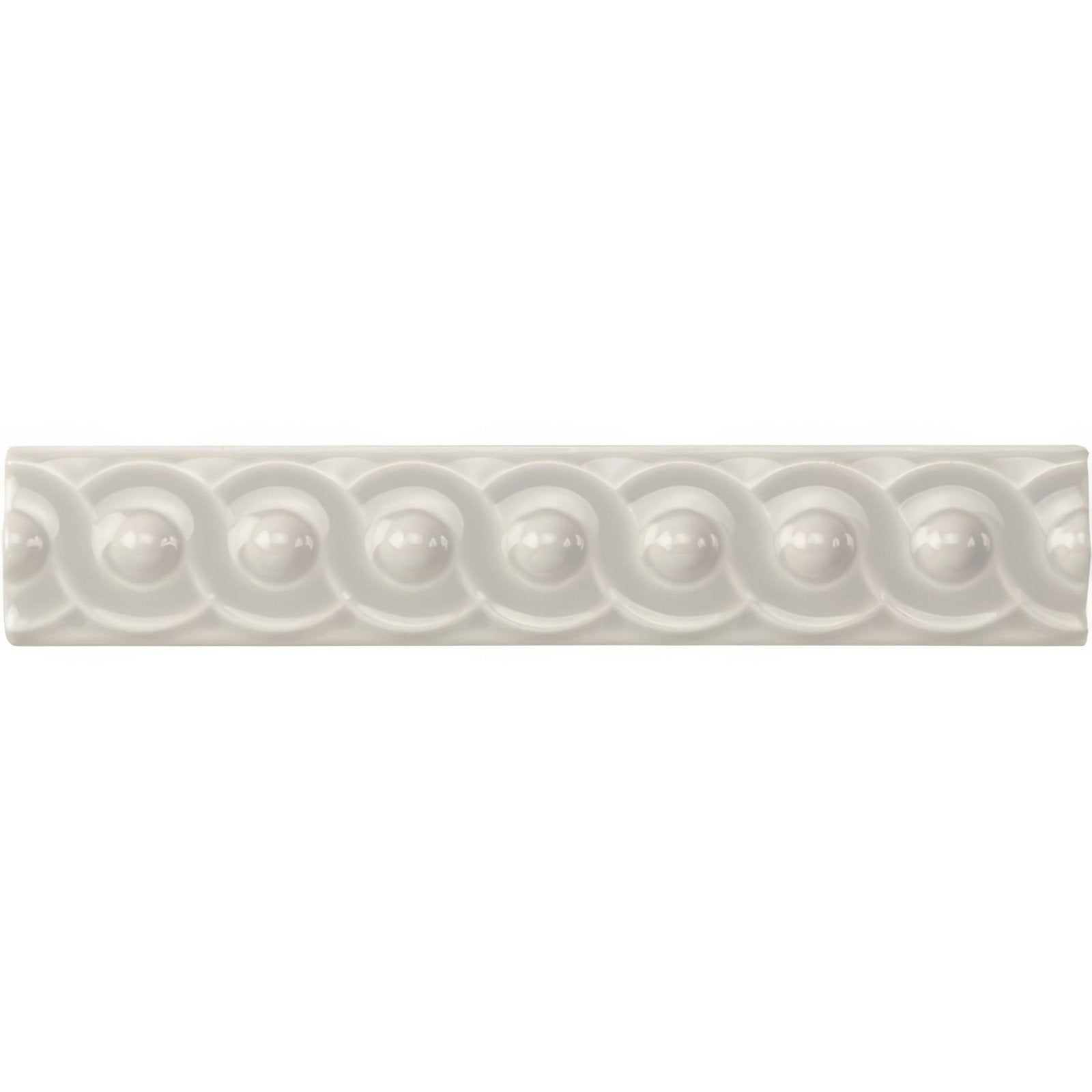 White ceramic tile with scalloped and rounded bead pattern in chancel grey scroll moulding design