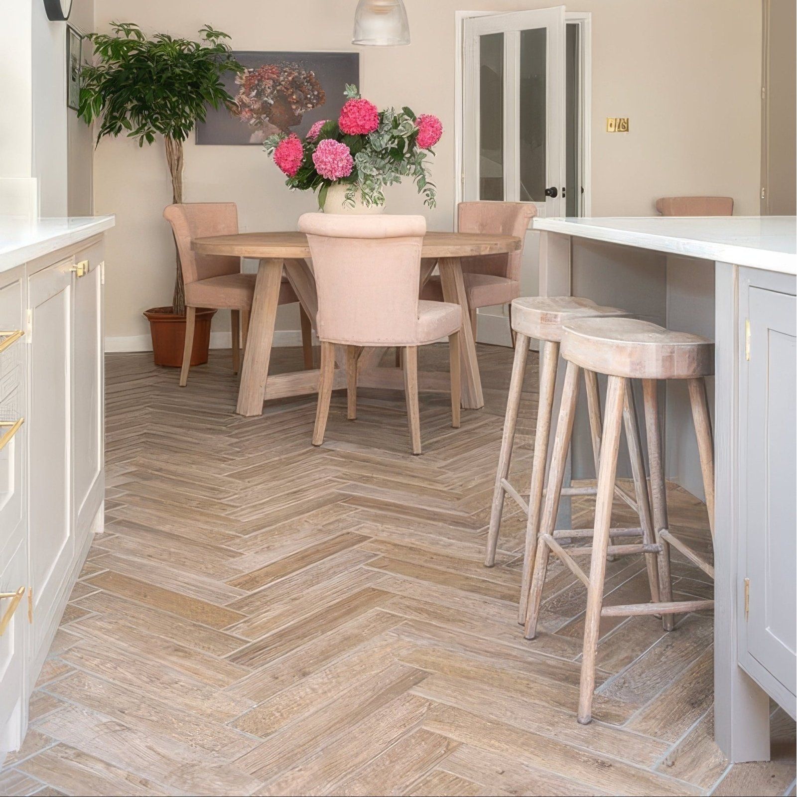 Light wood herringbone floor tiles made of chatham porcelain oak featuring a natural oak finish