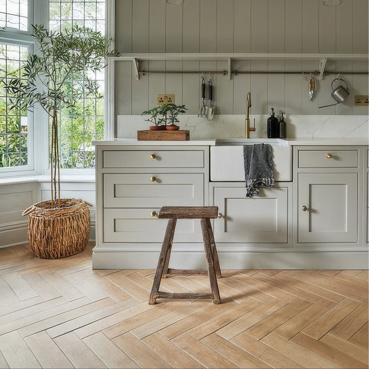 Rustic wooden stool with weathered finish and simple sturdy design in chatham porcelain oak wood