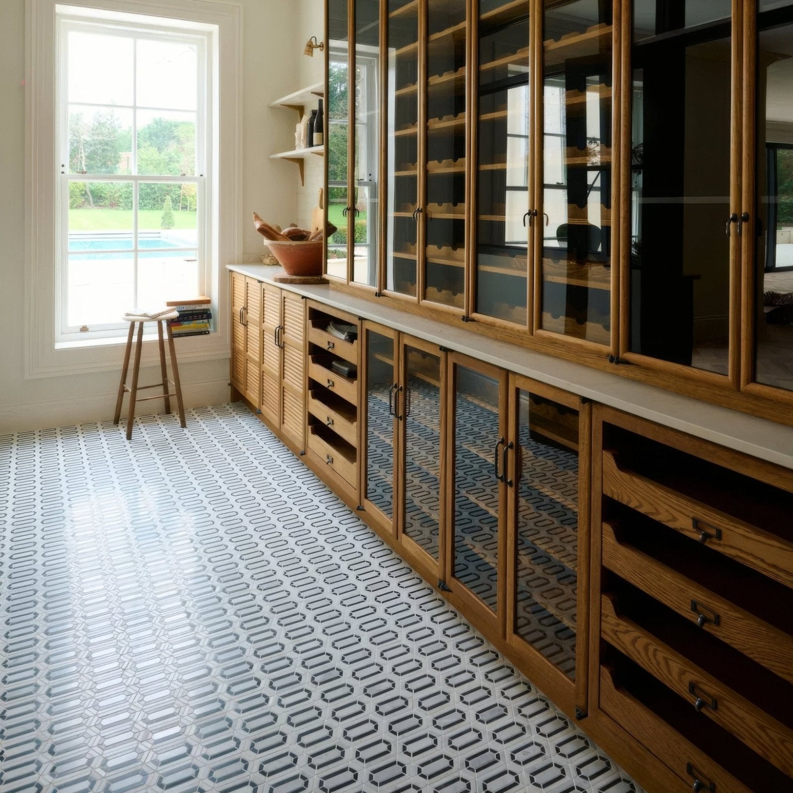 Chequers Court Double Hexagon white and black hexagon mosaic flooring with a wooden wine cabinet