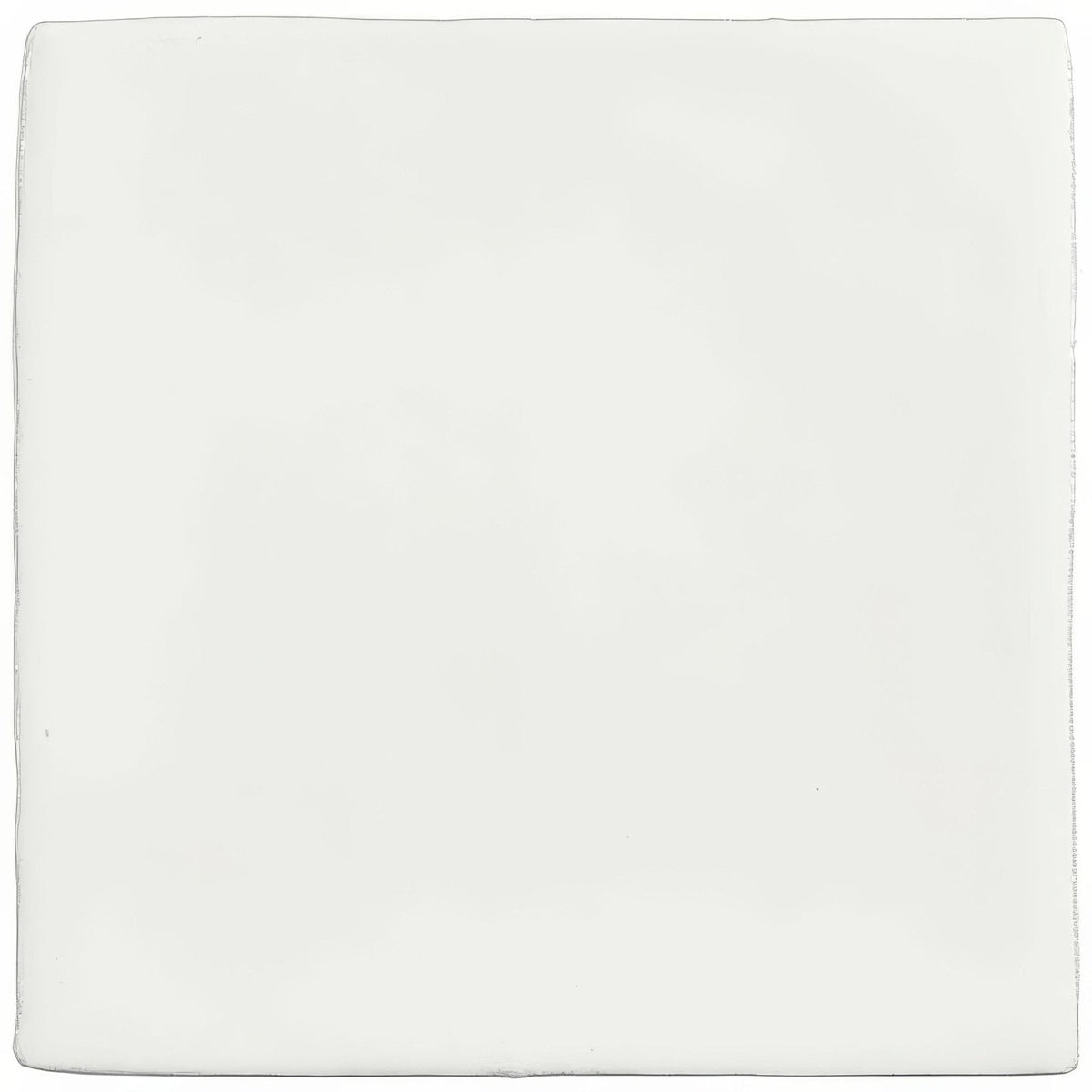A sleek minimalist white ceramic china white field tile with smooth edges and a glossy finish
