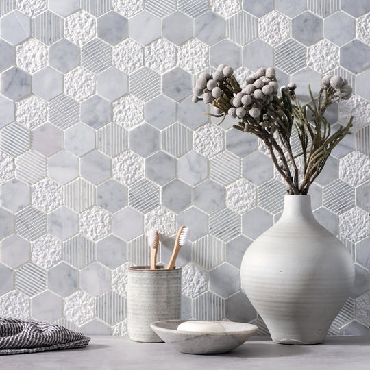 Cirrus Large Stone Hexagon white marble, glass and matte stone hexagon mosaic with a white ceramic vase