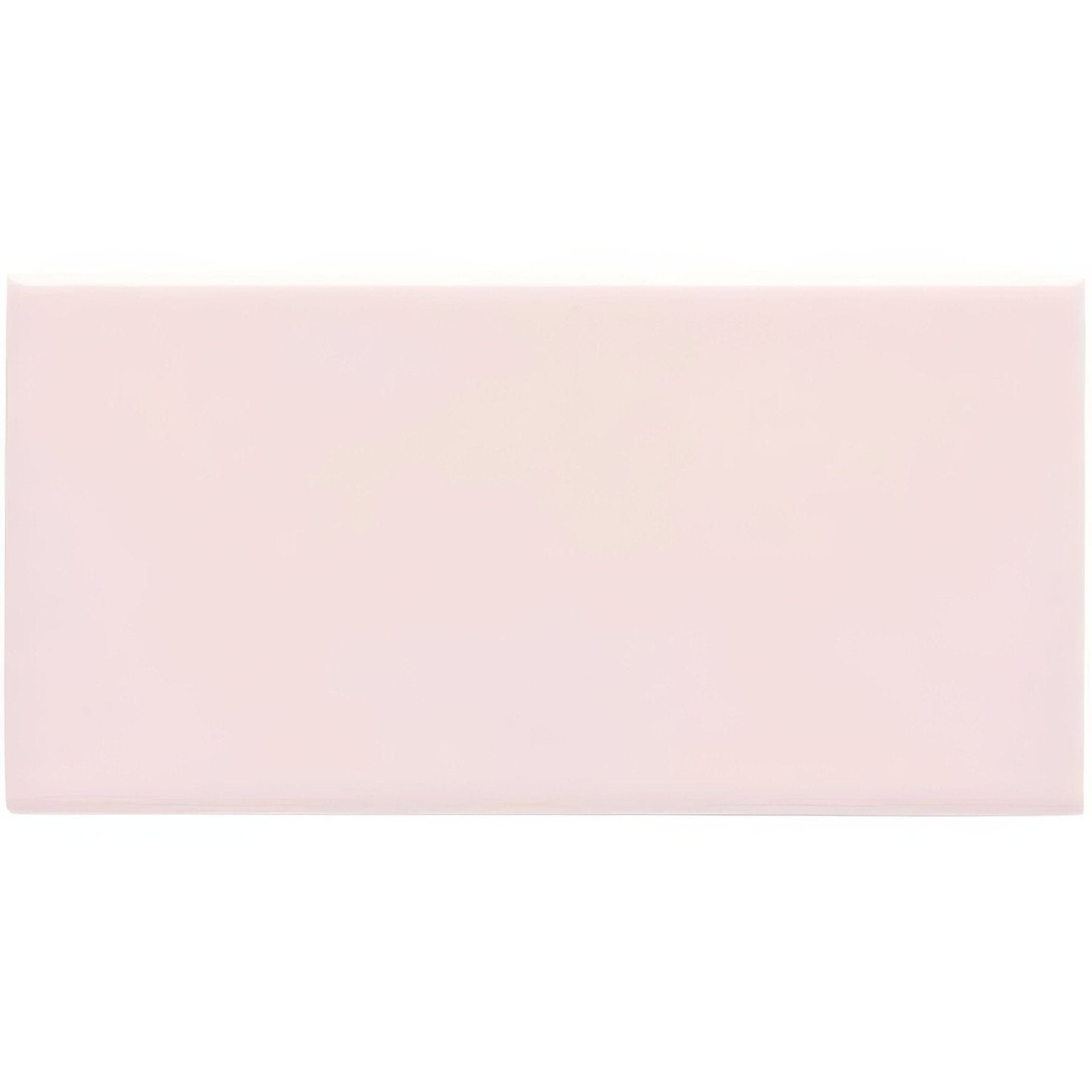 A soft blush pink clare half tile with a smooth matte finish ideal for wall tiling projects