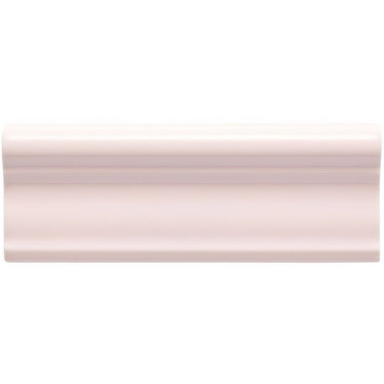 A matte off-white ceramic baseboard molding with a smooth curved profile from Clare Hampton