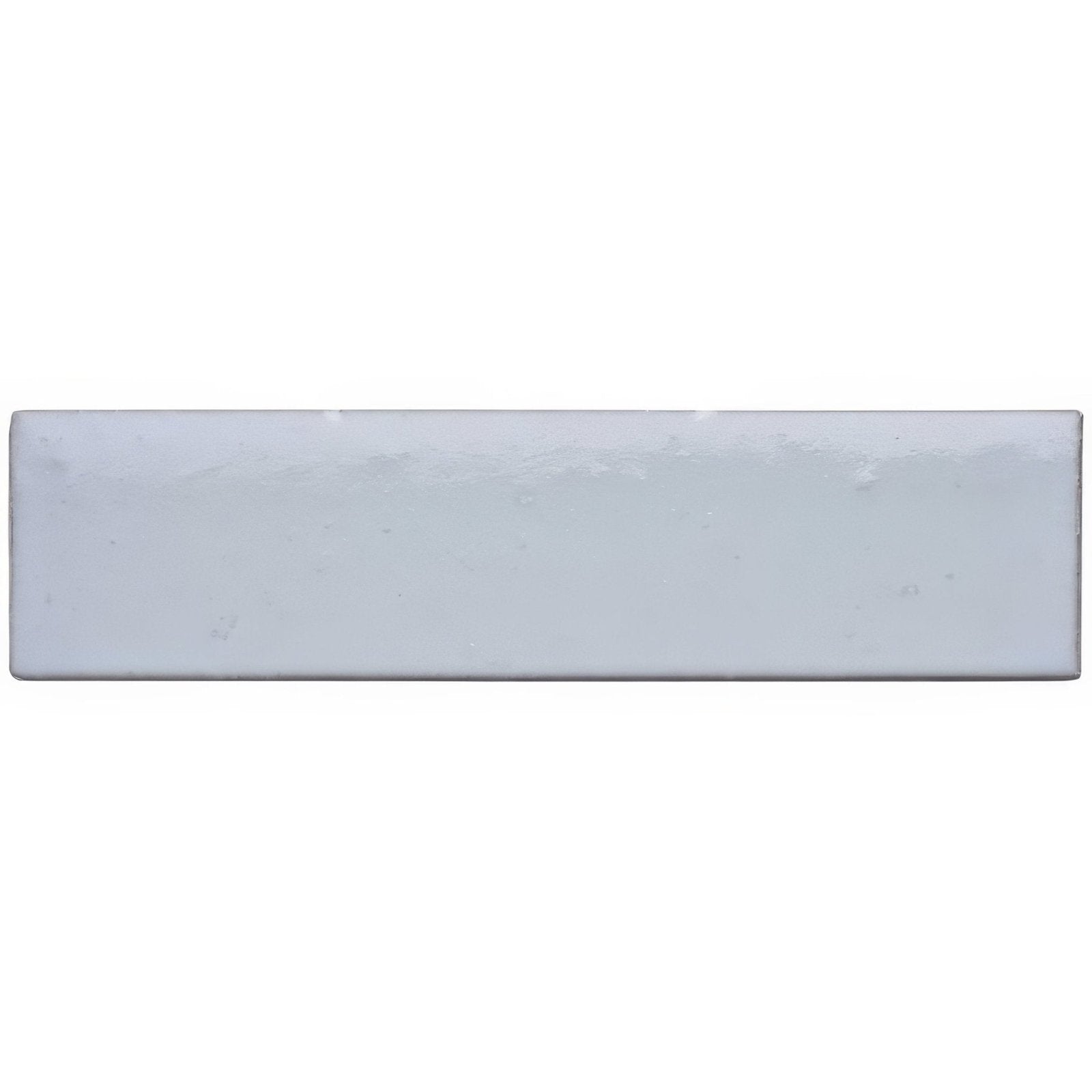 A sleek rectangular ceramic cloud smooth brick tile with a smooth matte finish in soft pale gray hue