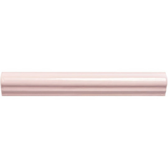 A sleek glossy pink ceramic clover ogee moulding baseboard with a smooth curved profile