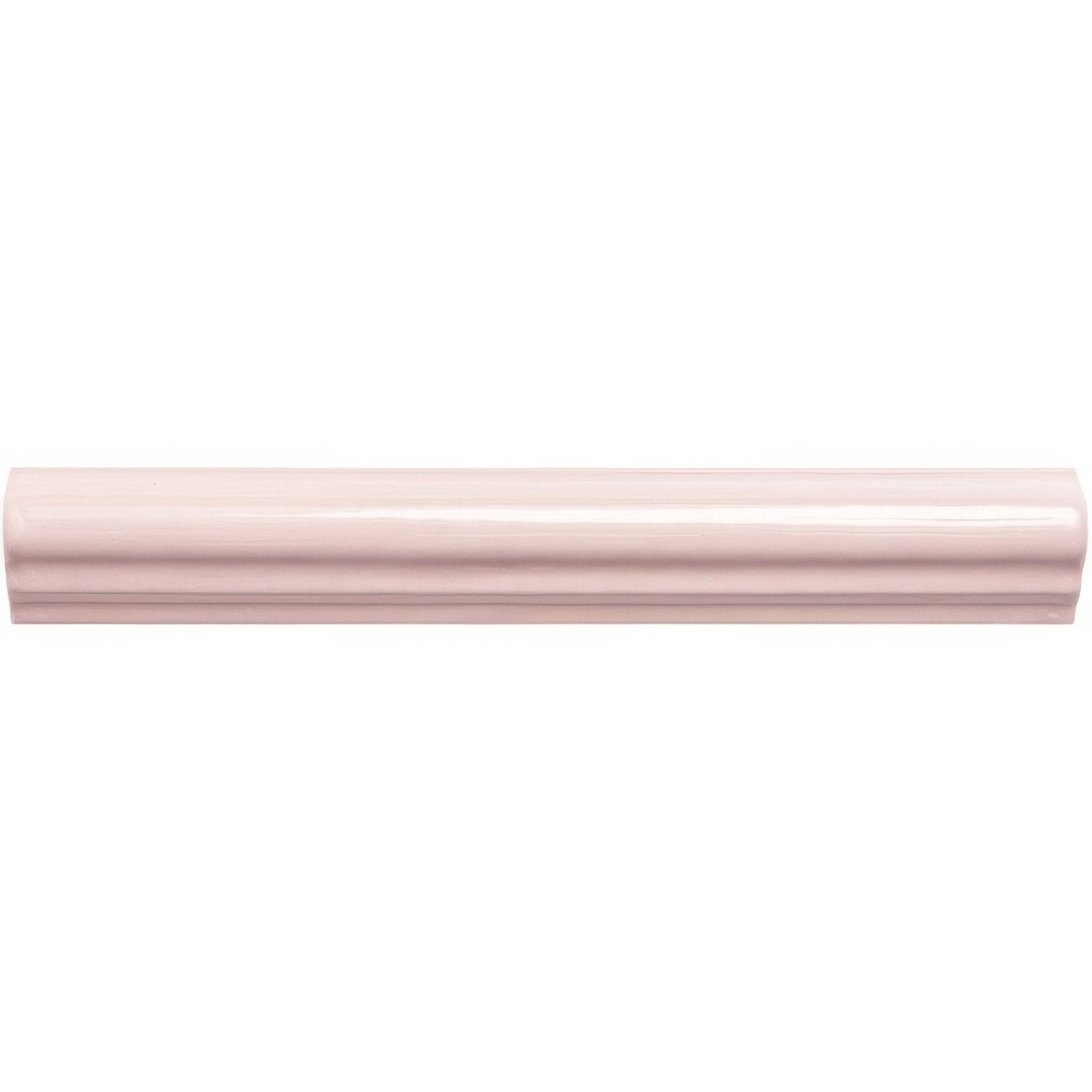 A sleek glossy pink ceramic clover ogee moulding baseboard with a smooth curved profile