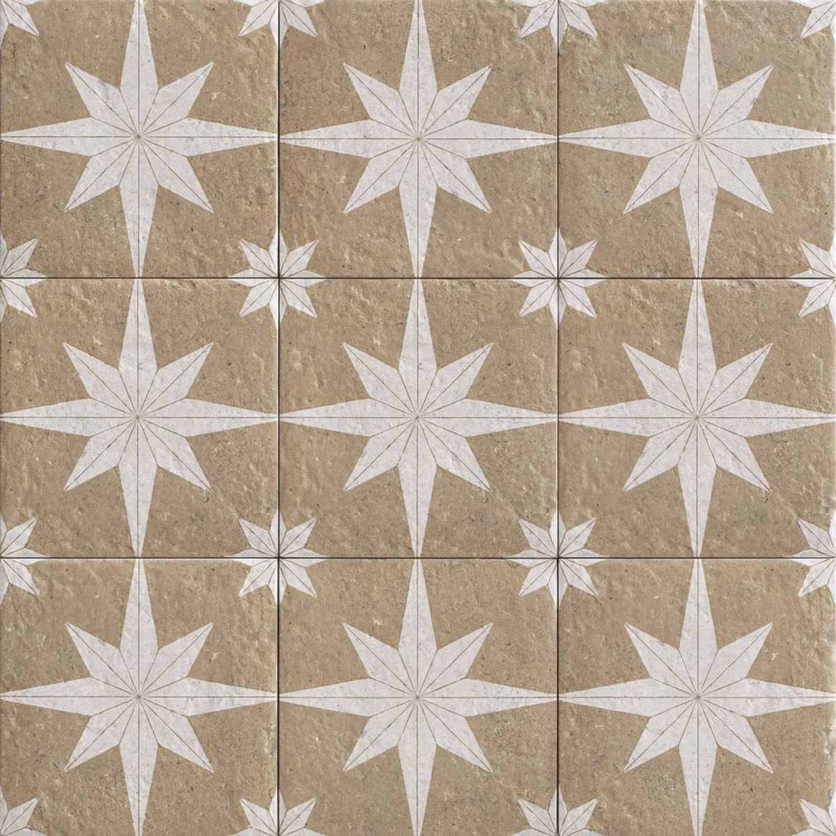 Beige stone tiles with white starburst inlay patterns from compass sand beige collection for interior flooring