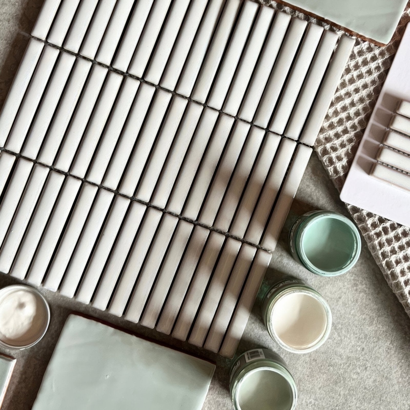 White rectangular ceramic tiles in a grid pattern from the copenhagen kit kat white mosaic collection