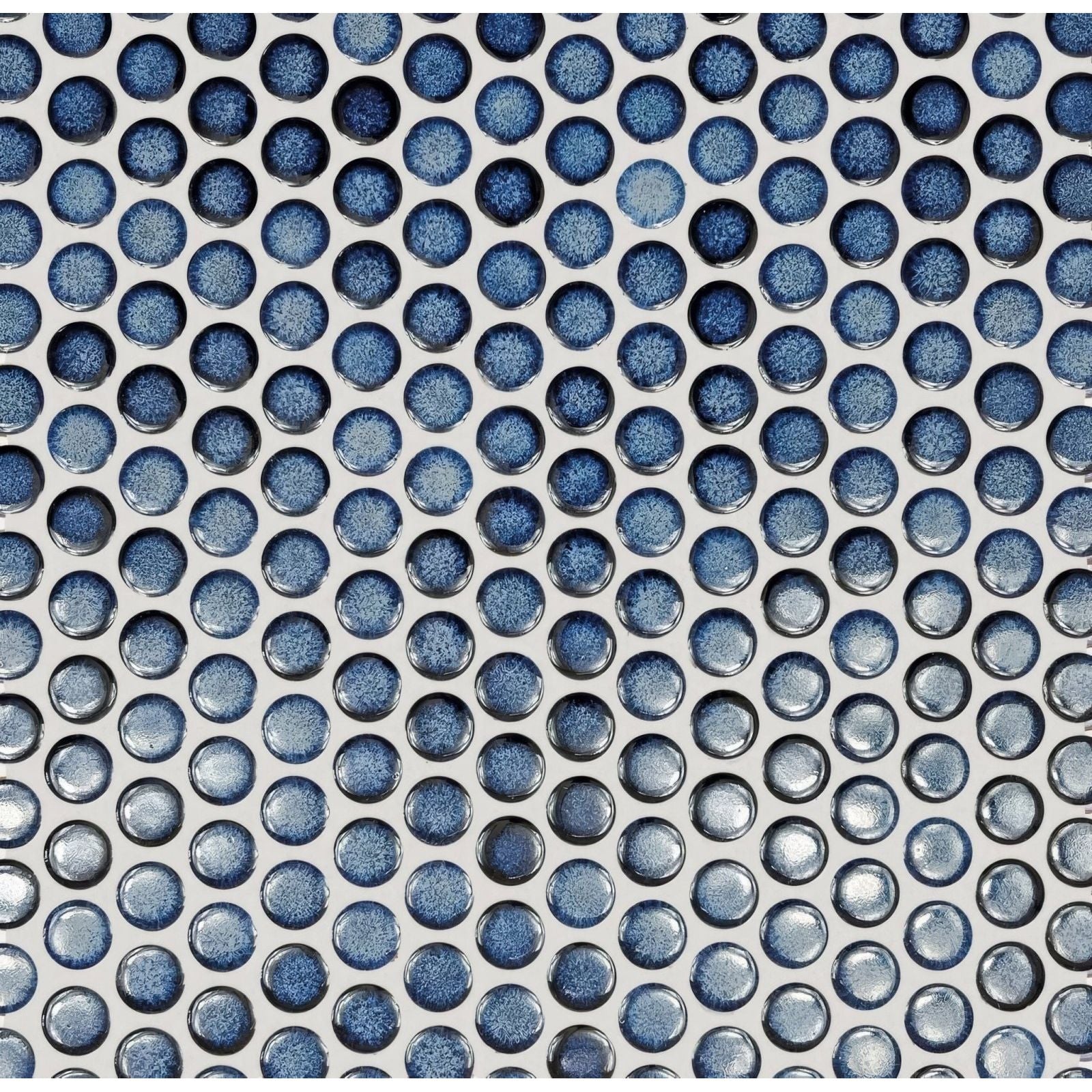Blue ceramic mosaic tiles with glossy speckled finish arranged in a grid pattern for copenhagen penny round blue mosaic