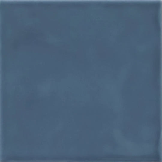 A square matte-finished blue ceramic Cordoba Ocean glazed tile with subtle tone and texture variations