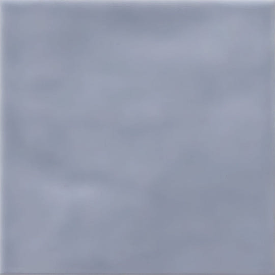 Cordoba sea mist glazed tile in light gray ceramic with a smooth matte finish and subtle veining
