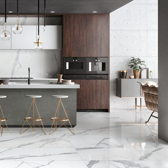Cosmopolitan Statuario Extra Matt 80 x 80cm white marble-effect tiles in a kitchen with dark wood cabinetry