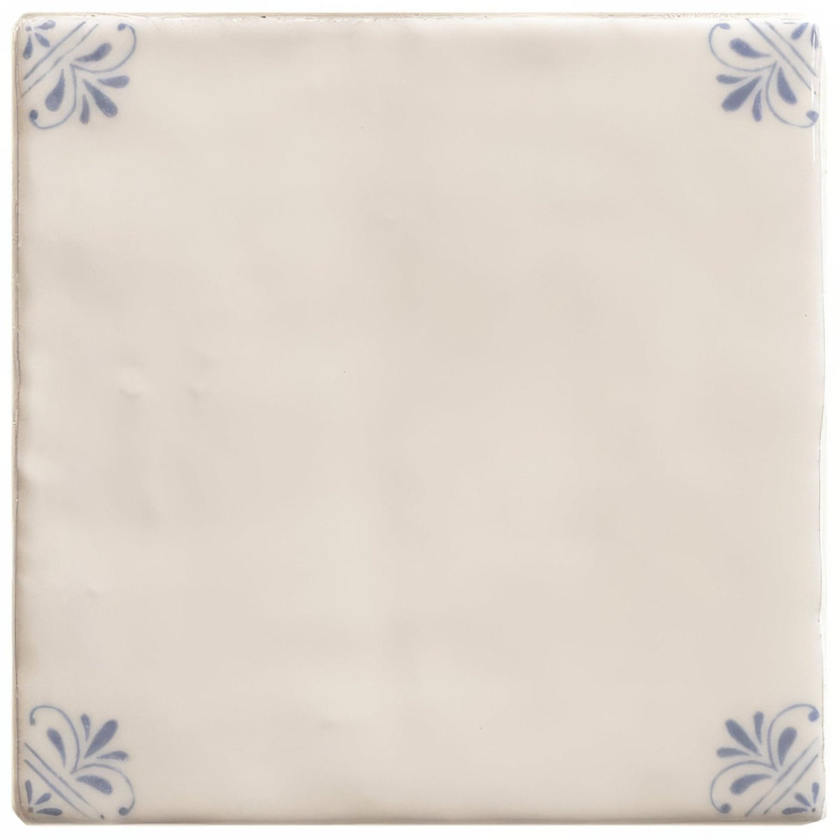 Cream-colored ceramic tile with delicate blue floral motifs in each corner from country Delft Beatrix collection
