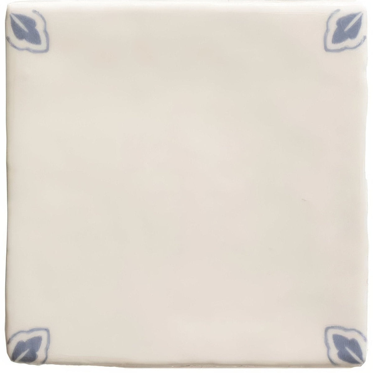 Cream-colored ceramic Country Delft Dorothea tile with subtle blue leaf motifs in each corner for decorative use