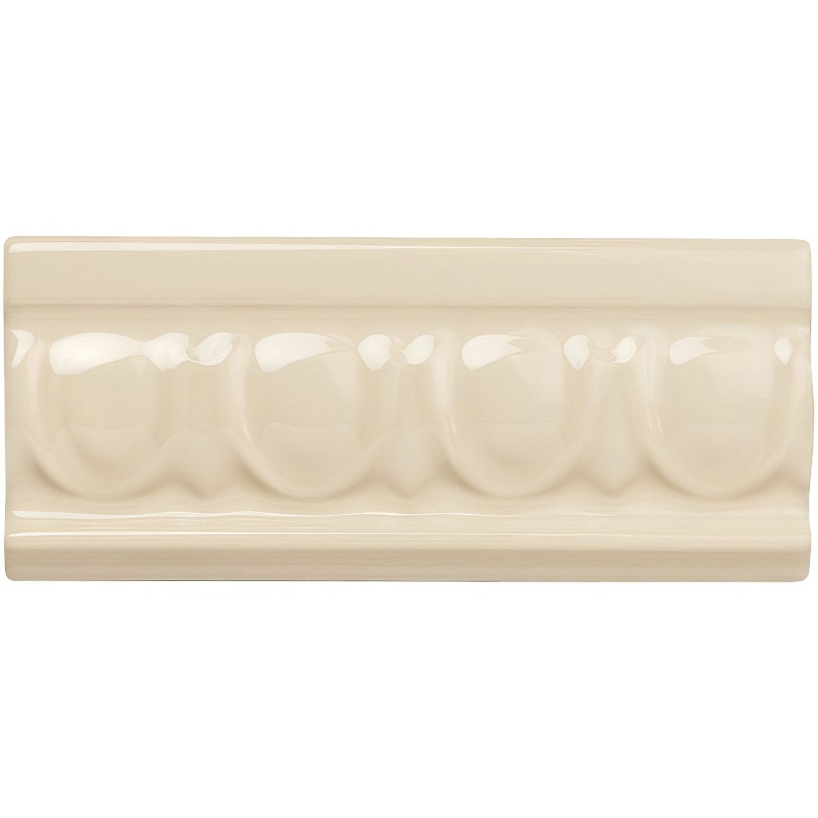 Cream-colored ceramic County White egg and dart moulding baseboard tile with glossy finish and raised decorative molding