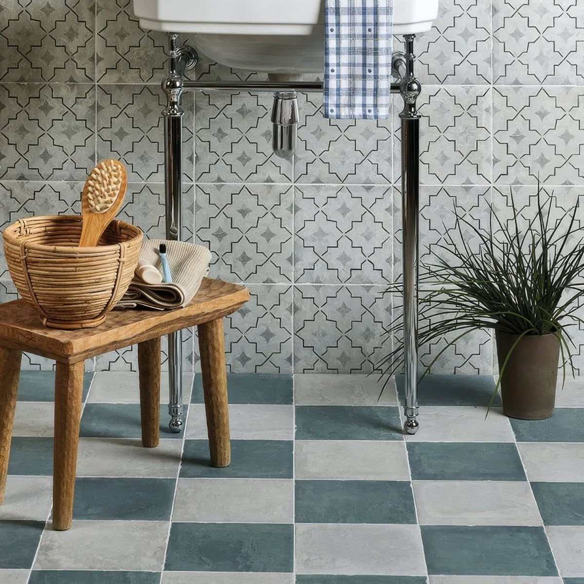 Woven wicker basket with a wooden brush inside featuring cuba porcelain mint green field design