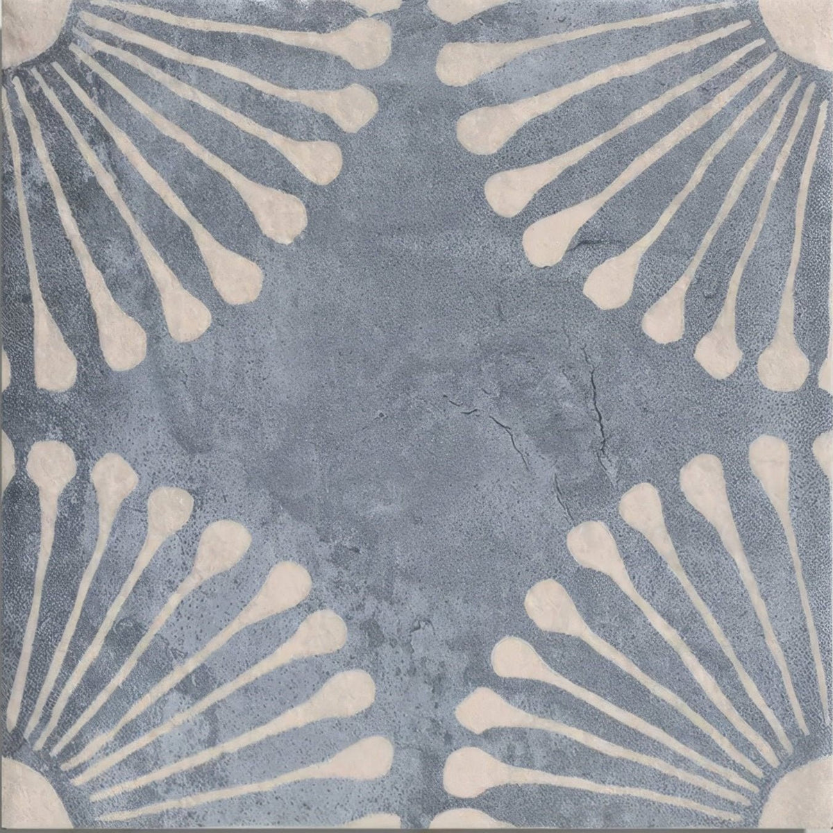 Blue-gray cuba porcelain vedado indigo ceramic tile with textured cracked surface and cream floral radiating patterns