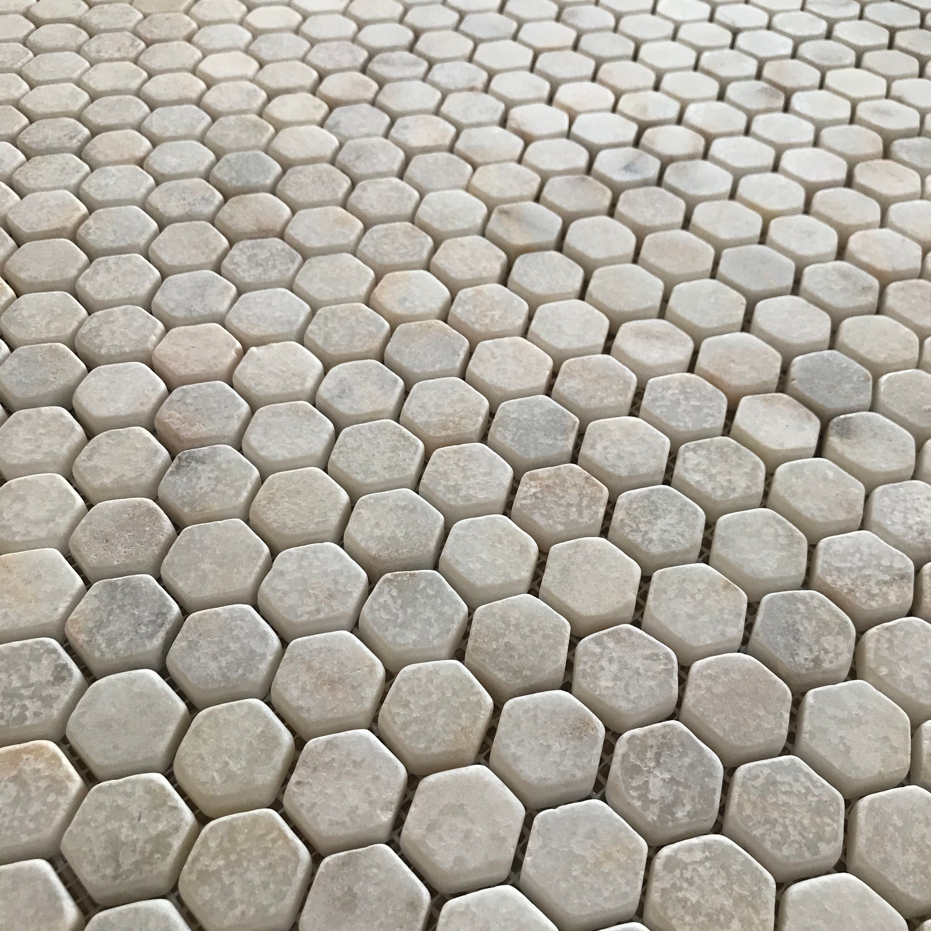 Full Calacatta Sugar hexagon mosaic sheet showing gold and grey veins arriving in fragments across the pieces