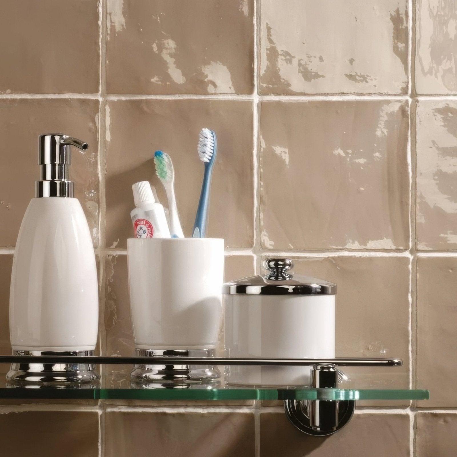 White ceramic toothbrush holder with chrome accents and matching lid featuring damask field tile design