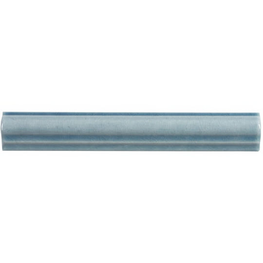 A sleek light blue ceramic ogee moulding danube tile with a subtle glossy finish and two parallel grooves