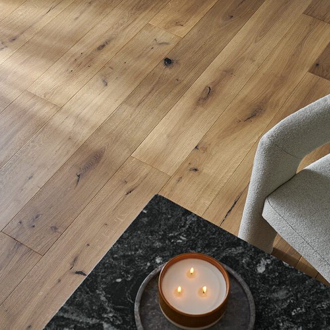 A warm-toned wooden floor with natural grain and knots in dartmouth beaten oak finish
