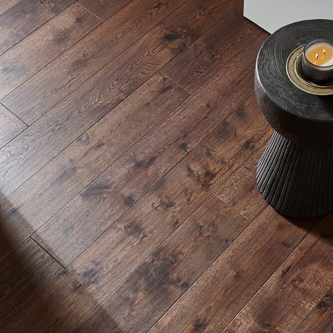 Dark brown hardwood floor with visible wood grain and natural imperfections in dartmouth passage oak material
