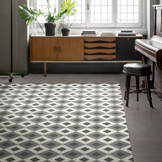 Geometric patterned floor tiles in modern gray and white design from de-segni mouk 20 x 20cm collection