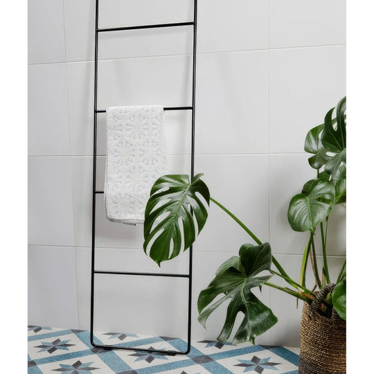 Delicate Wall Ceramic 33.3 x 55cm glossy white tiles with a black towel ladder